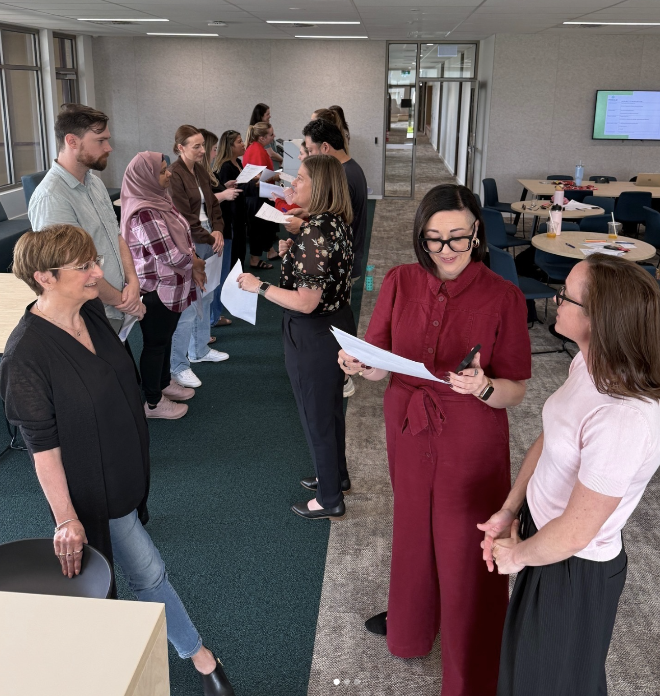 People participating in a team-building activity indoors.