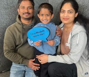 Family posing with Mindalk sports star sign.